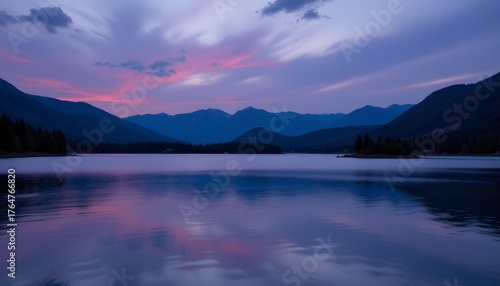 Tranquil Lake Reflection of Majestic Mountains During Serene Sunset in Wilderness