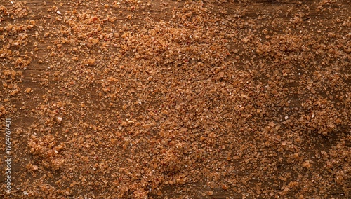 Dark coconut sugar on a rus...