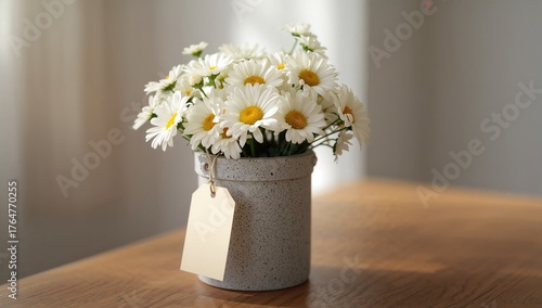 Concrete pot holding a bouq...
