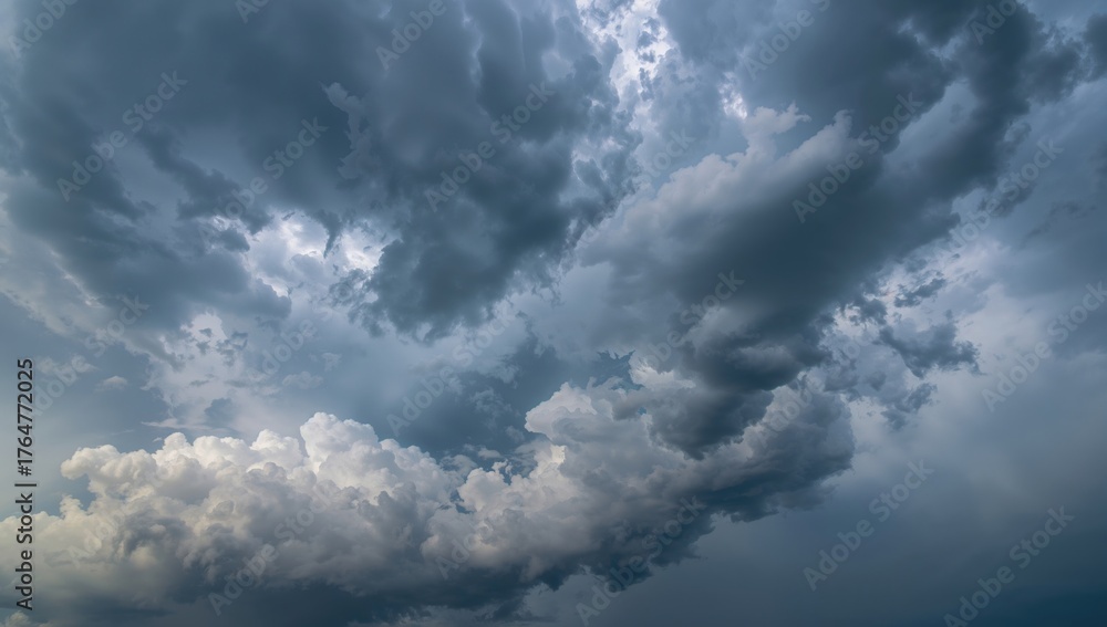 Obraz premium Dramatic tempest clouds shadow the sky during an enchanting rainfall.