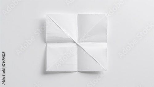 White paper creased into ni...