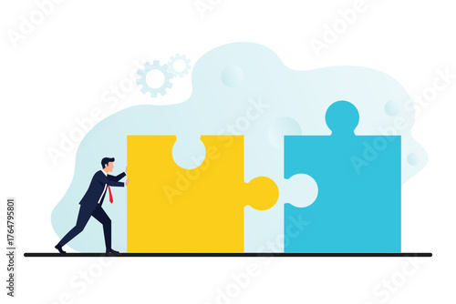 Businessman pushing puzzle pieces together, symbolizing teamwork, collaboration, and problem-solving