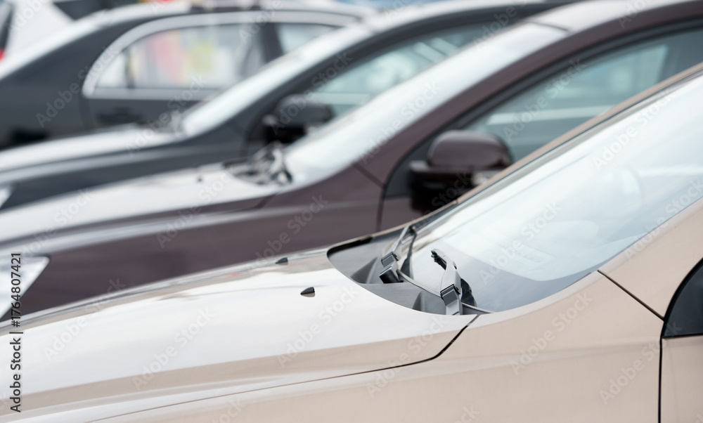 Fototapeta premium many cars parked in a row.