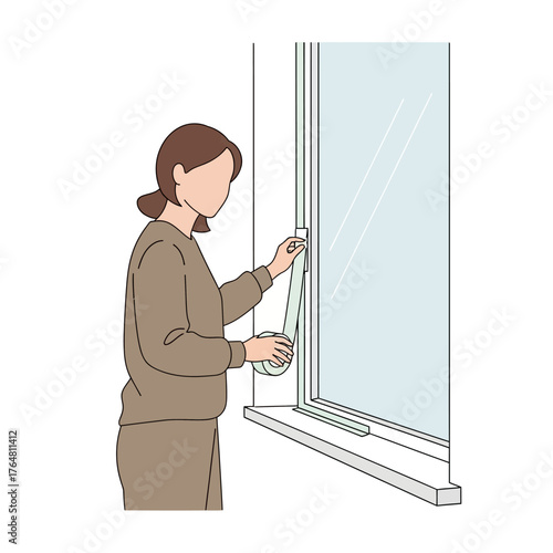 Woman applying tape to window frame for insulation, illustrating home energy saving and weatherproofing measures