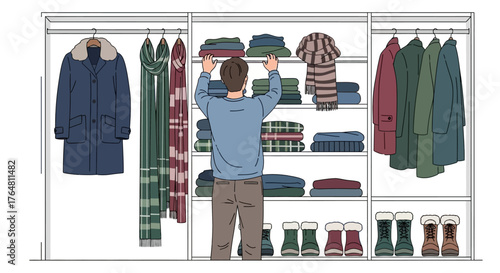 Person organizing winter clothes in closet, arranging coats, scarves, and boots neatly on shelves and hangers, showcasing wardrobe management and seasonal storage