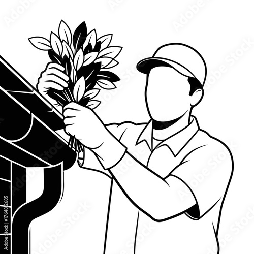 Gutter cleaning worker removing leaves and debris from roof gutter