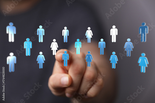 Hand pointing at human figu...