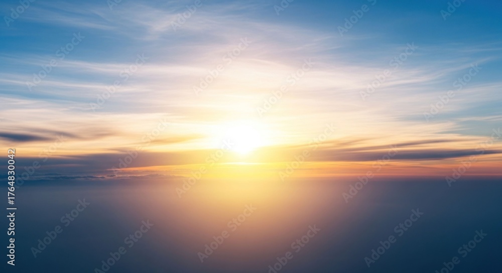 Fototapeta premium Golden sunlight bursts through layered clouds, washing sky in warm hues
