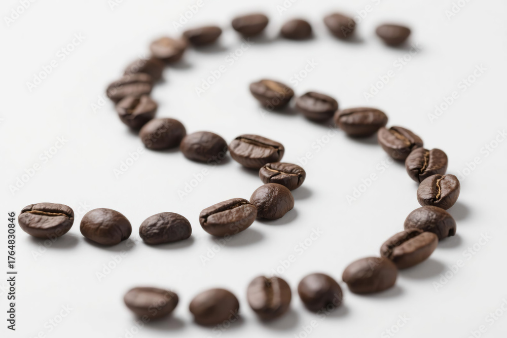 Naklejka premium A curved upward arc composed of multiple deep brown coffee beans of varying sizes, arranged in an orderly yet natural pattern against a clean white background, highlighting texture and three-dimension