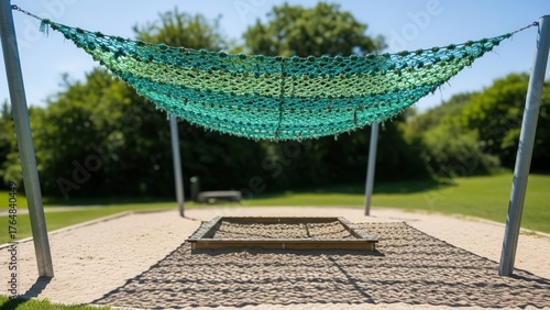 Wallpaper Mural Outdoor Playground Net Canopy Above Sand Pit with Wooden Border and Green Trees in Background Torontodigital.ca