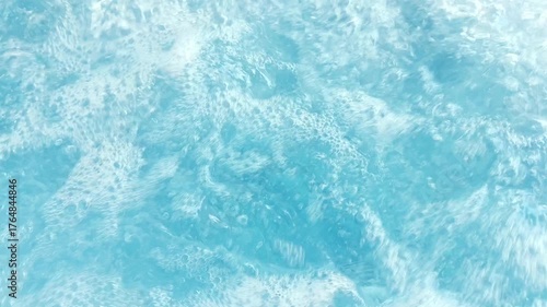 Boiling Blue Water in Spa. Bubbling Turbulent Surface, Aqua Liquid Texture, Relaxation and Wellness Abstract Background