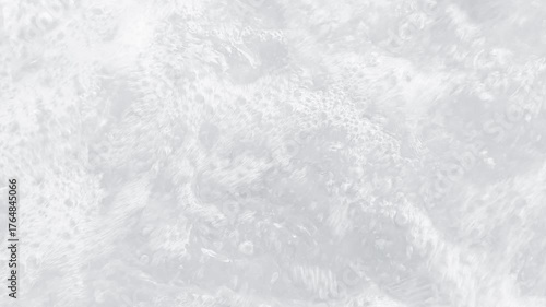 White transparent bubbling water surface. Mineral water background for spa, wellness, relaxation, purity, and freshness concepts. Ideal for beauty, health, and nature themes.