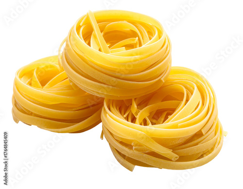Three stacked, golden, fresh nests of dried ribbon pasta isolated on a clean black background, side view