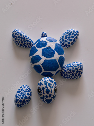 3.2 Photograph of a sea turtle painted on rocks. Final position