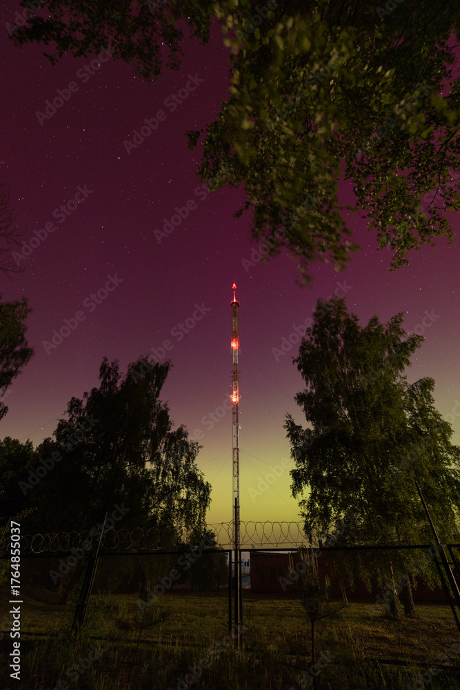 Obraz premium Illuminated Radio Tower Under Starry Night Sky