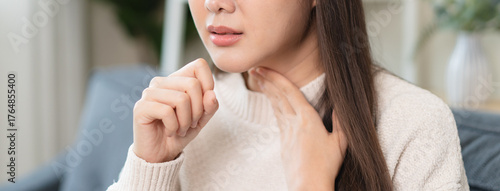 Bild auf Leinwand Women have a cough and a sore throat, and feel sick and cold.