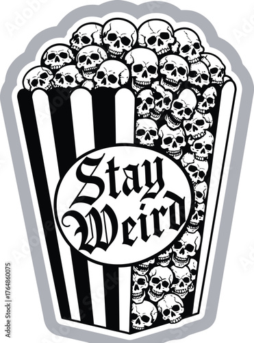 Popcorn bucket filled with skulls and the words stay weird in gothic font