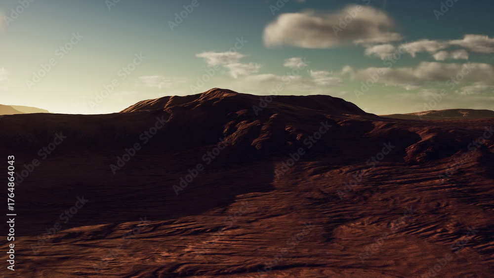 Fototapeta premium Soft light touches a vast red desert landscape. Gentle hills rise in the distance, and the sky is filled with scattered clouds as the sun sets, creating an otherworldly atmosphere.