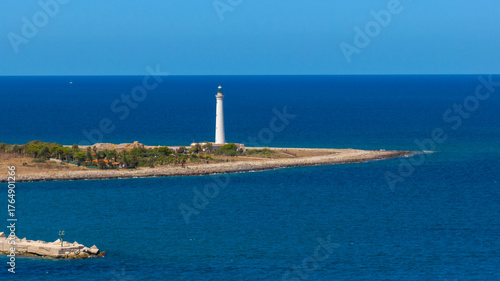 Aerial view of the white lighthouse of San Vito Lo Capo, on the coastline of the province of Trapani, Sicily, Italy. It is a lighthouse on the Tyrrhenian Sea coast. 