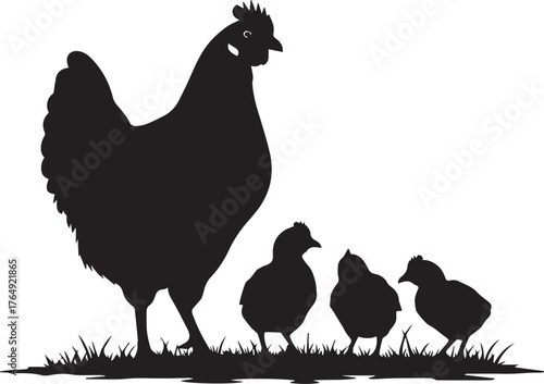 Silhouette of a mother hen standing protectively over her three fluffy chicks in green grass