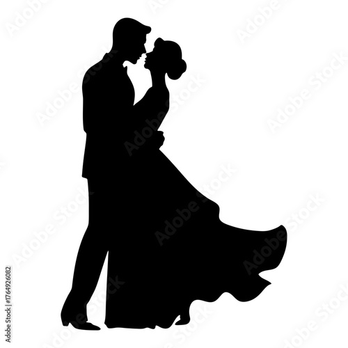 Silhouette of a couple embracing tenderly with the woman in a flowing gown and the man in a suit design