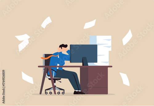 Frustrated businessman sits at his office desk with busy unfinished work, illustrating work stress. Concept of tiredness, fatigue from being overworked, and pressure to finish projects within deadline