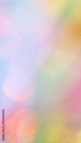 Colorful pastel abstract background with soft blurred light and rainbow gradient.