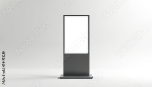 Empty black pylon with blank white screen on grey background. Isolated street signage mockup. Vertical display for advertisement. Blank vertical totem signage for outdoor advertising. Empty digital