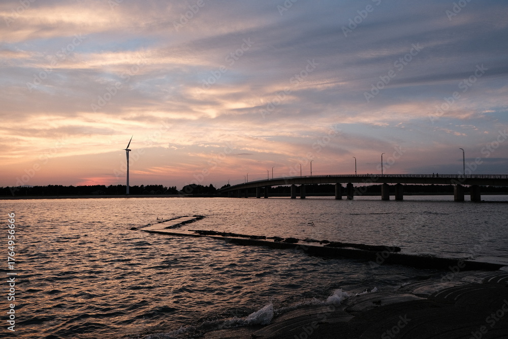 Fototapeta premium Colorful Sunset Water Wind Turbine Tranquil Sky