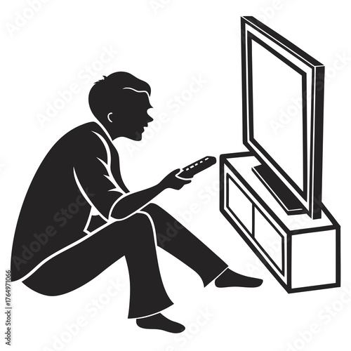 Man sitting on floor watching television