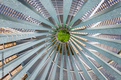 Abstract spiral metal structure with geometric pattern and symmetry, creating a modern industrial background with strong architectural design elements.