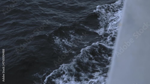 Waves splash from a moving boat on the Atlantic Ocean off Northern Norway