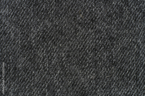 Dark gray woven fabric texture—symbolizing neutrality, rhythm, and the primal tactility of structured material presence.