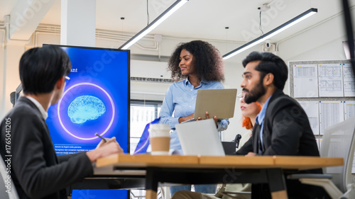 Multiethnic business and creative team collaborating meeting in modern office using AI assistant, big data, and digital tools for innovation and strategy.