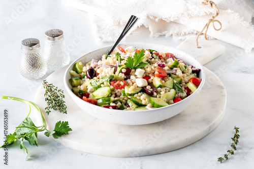 Homemade delicious Mediterranean Israeli couscous salad ready for eating.