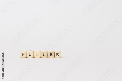 Wooden blocks spelling future on a minimalistic background, symbolizing hope, potential, and aspirations for what lies ahead. copy space
