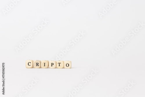 Wooden blocks spelling crypto on a minimalistic white background, symbolizing the growing influence of digital finance and technology concepts. copy space