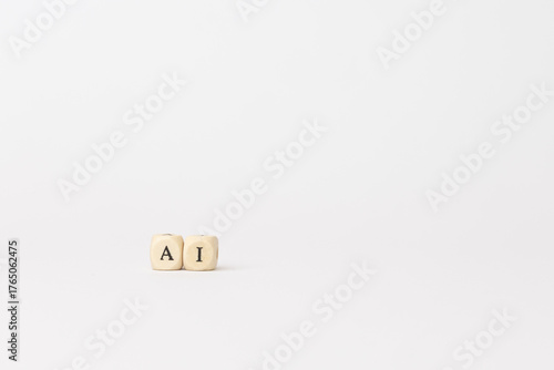 Wooden blocks displaying letters AI on a minimalistic white background, symbolizing artificial intelligence and modern technology concepts. copy space