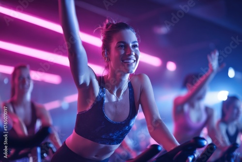 Wallpaper Mural Participants engage in a lively spin class, pedaling with enthusiasm under colorful neon lights. The atmosphere is energetic and motivating as they sweat together Torontodigital.ca