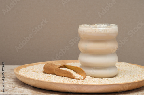 Tahini Latte. Coffee with sesame paste tahini in a cup on the Travertine table