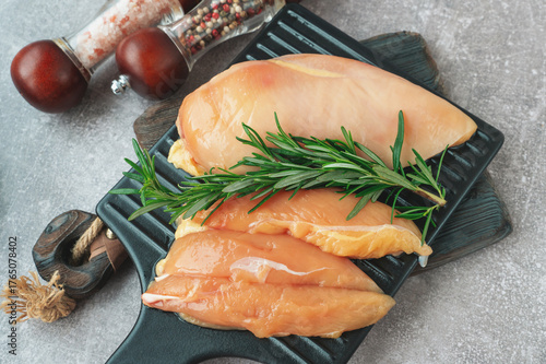 Poultry meat is ready for use. Fillets of raw chicken breasts on a cutting board
