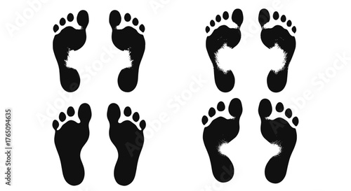 Four stark black footprints create a visually striking pattern on a clean white background, suggesting movement and presence.