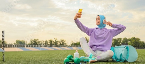 Sporty Muslim woman taking ...