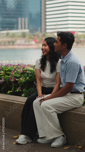 Young asian couple enjoying a date in a city park