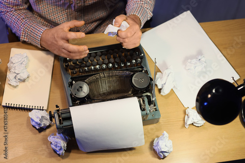 Young male writer with vint...