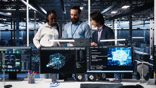 Happy data center coworkers monitoring neural network AI LLM visualization. Jolly workers in high tech facility using devices to oversee servers powering machine learning processes, camera A
