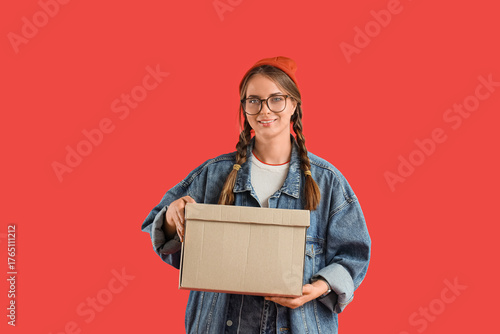 Young woman with cardboard ...