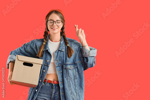 Young woman with cardboard ...