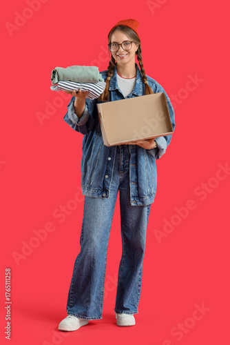Young woman with cardboard ...