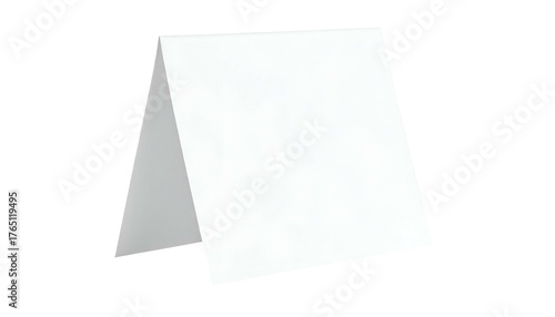 A blank, white tent card, folded in half, standing against a dark background